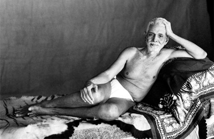 Sri-Ramana-Maharshi-reclining-in-the-Old-Hall-where-he-lived-from-1927-to-1950