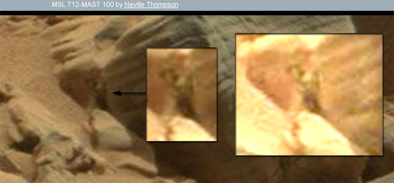 Mars-humanoid-looking-face-peeking-through-rock-opening